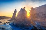 Very Large And Beautiful Chunk Of Ice At Sunrise In Winter Stock Photo