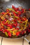 Fried Chili Pepper And Vegetable On A Wok Pan Stock Photo