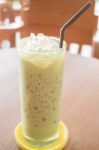 Glass Of Iced Green Tea Latte Stock Photo