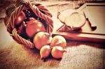 Loose Onions Scattered From Wicker Basket Stock Photo