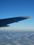 Airplane Wing View With Gorgeous Clouscape Stock Photo