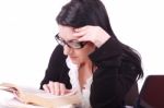 Business Lady Reads Book In Office Stock Photo