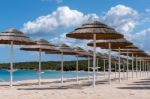 Parasols At Liscia Ruja Beach In Sardinia Stock Photo