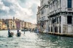 Gondoliers Ferrying People In Venice Stock Photo