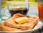 Breakfast Butter Toast Means Fruit Jam And Beverage Stock Photo