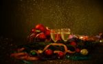 Two Glasses Of Champagne With A Christmas Decor In The Background Stock Photo