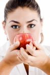 Female Holding Apple Near Her Face Stock Photo