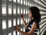 Woman With A Sad Expression On A Dramatic Background Stock Photo