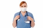 Female Surgeon Wearing Face Mask Stock Photo