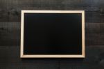 Empty Chalkboard On Wooden Background Stock Photo