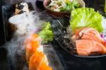 Set Of Salmon Menu Served On Black Plate Stock Photo