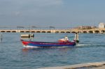 Powerboat Near The Railway Line Into Venice Stock Photo