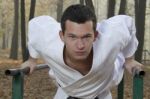 Karate Training In Autumn Forest Stock Photo