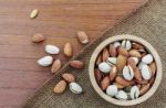 Almonds In Bowls On Sacks Stock Photo