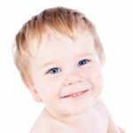 Toddler Blond And Blue Eyes Boy Stock Photo