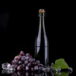 Wine Bottle With Red Grape Stock Photo