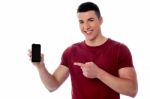 Smiling Man Displaying His Mobile Phone Stock Photo