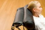 Woman Lying On Chaise Longue Stock Photo