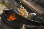 Stir fried rice being cooked in wok Stock Photo