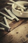 Cigarette With Ashtray On Wood Table Stock Photo