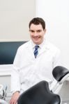 Orthodontist Posing In Lab Coat Stock Photo