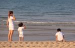 Asian Mom And Son On Beach Stock Photo