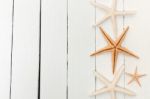 Starfish On White Wood Stock Photo