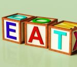 Wooden Block With Eat Text Stock Photo