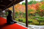 Woman In Enkoji Temple Enjoys Autumn Colorful Japanese Garden Stock Photo