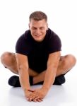 Smiling man sitting in floor Stock Photo