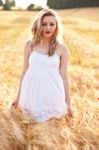 Portrait Of Beautiful Girl In Field Stock Photo