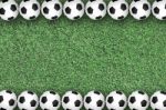 Soccer Balls On Green Grass Stock Photo