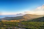 Spring Sunset In The Mountains. Seacoast And Hills Stock Photo