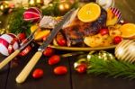 Christmas Baked Duck Served With Potatoes, Orange And Tomatoes Stock Photo