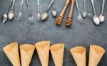 Flat Lay Ice Cream Cones Collection , Spoons ,fork And Honey Dip Stock Photo