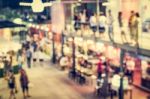 Blurred People In The Night Market Stock Photo