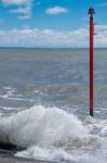 Warning Lamp In The Sea At Lyme Regis Stock Photo