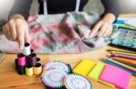 Beautiful Young Fashion Designer Woman Choosing Thread For Sewin Stock Photo