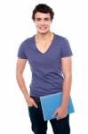 College Student Holding Notebook Stock Photo