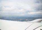 Clouds And Land As Seen Through Window Of An Aircraft Stock Photo