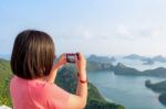 Woman On Peak Take Photos Stock Photo