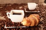 Coffee Beans And Croissant Stock Photo