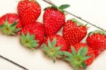 Fresh Organic Strawberry Over White Wood Stock Photo