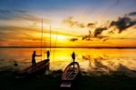 Silhouette Of Children On Boat  Stock Photo