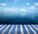 Ocean With Sky And Wood Floor Stock Photo