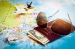 Sunglasses, Passport, Money, Compass And Aircraft On The World M Stock Photo