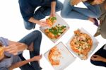 Teenagers Eating Pizza Stock Photo