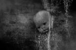 Spooky Doll In Haunted House Stock Photo