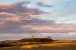 Craster, Northumberland/uk - August 20 : Sunset Over Dunstanburg Stock Photo