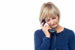 Unhappy Woman On The Phone Stock Photo